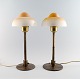 Fog & Mørup : A pair of fried eggs tablelamps. Brass frames with glass shades.
