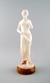 Large figure of naked woman in alabaster on marble base.
Early 20 c. Unknown artist.