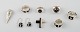Samling smykker af sterlingsølv, de fleste med monteringer af ibenholt, 
bestående af 5 ringe, to vedhæng og et par ørehængere. 
Dansk design.
