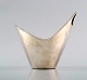 Modern bowl made by F. Hingelberg of sterling silver with smooth corpus in 
asymmetric design, handle on one side.