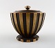 Tinos style art deco lidded jar in bronze.
