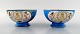 Sevres, Chateau des Tuileries, France, a pair of bowls in Sevres-blue, hand 
painted with angels and flowers.