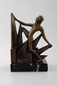 Art deco bookend in bronze on marble base.
