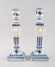 A pair of Royal Copenhagen Blue Fluted plain, candlesticks with lion heads.