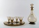 SIMON GATE for Orrefors, Art Deco Art Glass 4 p. Liqueur set with carafe on a 
tray, smoke colored.