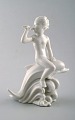 Harald Salomon for Rörstrand, blanc de chine / white glazed figure of a fawn 
riding on dolphin.