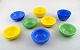Orrefors "Colora" 8 skåle i kunstglas i forskellige farver. 
Designet af Sven Palmqvist.