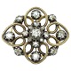 A diamond brooch mounted in 14k gold and white gold