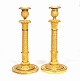 A pair of Louis XVI gilt candle sticks. Paris circa 1800. H: 33cm