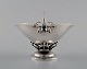 Georg Jensen: Bowl of sterling silver, forged with flower buds and pierced 
strain with leaves.