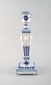 A Royal Copenhagen Blue Fluted plain, candlestick with lion heads.
