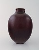 Royal Copenhagen Kresten Bloch unique stoneware vase in oxblood glaze.
