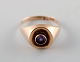 Viggo Pedersen, Danish goldsmith. 14 carat art deco gold ring adorned with 
purple stone.