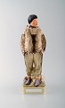 Carl Martin-Hansen: Porcelain figure of male in national dress (Greenland). 
Royal Copenhagen, Queen Juliana Maria mark.