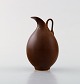 Berndt Friberg for Gustavsberg. Modernist jug in ceramics. Beautiful glaze in 
brown shades. 1960