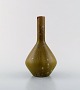 Carl-Harry Steel tap for Rörstrand / Rørstrand. Narrow-necked ceramic vase with 
beautiful glaze in olive green shades. Rare shape.