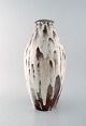 Mobach, Holland. Large art deco vase in glazed ceramics. White running glaze on 
purple base. 1940