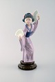 Lladro, Spain. Large figure in glazed porcelain. Geisha with fans. 20th century.