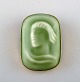 Jais Nielsen for Royal Copenhagen. Brooch / pendant made of celadon glazed 
porcelain embedded in gilded sterling silver