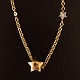 Ole Lynggaard; necklace in 14k gold with star shaped lock and a star shaped 
pendant with two diamants