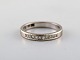 Swedish modernist alliance ring in 18 carat white gold with diamonds. Dated 
1976.