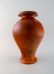 Svend Hammershøi for Kähler, Denmark. Large vase in glazed stoneware. Beautiful 
orange uranium glaze. 1930 / 40