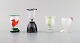 Ulrica Hydman Vallien for Kosta Boda. Four glass / vases in mouth blown art 
glass. Swedish design, 1980