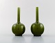 A pair of English narrow necked vases in green glazed ceramics. 1920/30