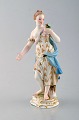 Meissen porcelænsfigur. Kvinde i kjole med blomster. Ca. 1900.
