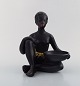 Gmundner Ceramics, Austria. Nude "Negresse" sculpture in black ceramic with 
grass skirt. 1950