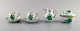 Herend "Chinese bouquet". Two coffee cups with saucers and sugar / cream sets in 
porcelain with gold decoration and green flowers. Mid 20th century.
