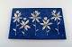 Heinz Erret (1920-2003) for Gustavsberg. "Skogsstjärna" wall plaque in glazed 
ceramic with silver inlay in the form of flowers. 1970