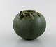 Arne Bang, Denmark. Round vase in glazed ceramics. Beautiful glaze in green 
shades with foliage in relief. 1940