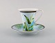 Gianni Versace for Rosenthal. "Jungle" coffee cup with saucer in porcelain with 
gold decoration and green leaves. Late 20th century.
