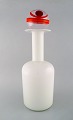 Otto Brauer for Holmegaard. Large vase / bottle in white art glass with ball. 
1960