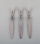 Three Georg Jensen "Cactus" sterling silver cold meat forks.
