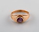 Scandinavian jeweler. 14 carat gold ring adorned with amethyst. Mid 20th 
century.
