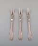 Three Georg Jensen "Continental" cold meat forks in sterling silver. Dated 
1915-30.
