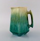 Antique Höganäs art nouveau jug in glazed ceramics. Beautiful glaze in turquoise 
shades. Early 20th century.
