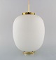 Bent Karlby: "The China light". Danish design.
Pendant in matte opal glass with brass fitting.