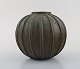 Arne Bang. Rare spherical shaped art deco vase of stoneware, modeled in fluted 
style. Beautiful glaze in earth shades. 1940