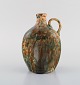 Gustaf Johnn for Höganäs. Antique art nouveau jug in glazed ceramic. Late 19th 
century.
