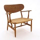 A very beautiful patinated oak armchair by Hans J Wegner CH22. Made by Carl 
Hansen & Søn, Denmark