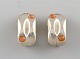 Maria Berntsen for Georg Jensen. A pair of "Mirror" ear clips in sterling silver 
adorned with moonstones. Late 20th century.

