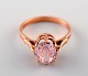 Vintage art deco ring in 14 carat gold adorned with large pink semi-precious 
stone. 1940