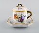 Royal Copenhagen Saxon Flower. Cream cup with saucer in hand-painted porcelain. 
Model number 1542. Early 20th century.
