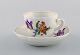 Antique Meissen coffee cup with saucer in hand-painted porcelain with floral 
motifs. 19th century.
