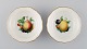 Two Meissen bowls in hand-painted porcelain with fruit motifs and gold edge. 
20th century.

