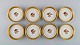 Otte Royal Copenhagen Guldkurv flaskebakker i porcelæn med guldkant. Modelnummer 
2422. Midt 1900-tallet.
