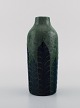 Gunnar Wennerberg for Gustavsberg. Antik unika vase i glaseret keramik. Sorte og 
blå blade på grøn baggrund. Dateret 1905.
